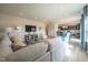 Open-concept living room with a large sectional sofa and seamless flow into the kitchen at 505 Marthas View Way, Wake Forest, NC 27587