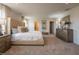 Spacious main bedroom featuring plush carpeting, stylish furnishings, and ample natural light at 505 Marthas View Way, Wake Forest, NC 27587