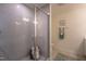 Modern tiled shower with glass door, complete with a built-in niche and stylish fixtures at 505 Marthas View Way, Wake Forest, NC 27587