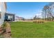 A sprawling backyard features lush green grass, perfect for outdoor activities and relaxation at 509 Marthas View Way, Wake Forest, NC 27587