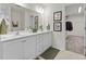 Bathroom featuring double sinks and a large mirror at 509 Marthas View Way, Wake Forest, NC 27587