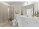 Bathroom with a glass-enclosed shower and white cabinets at 509 Marthas View Way, Wake Forest, NC 27587