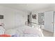 A cozy bedroom features neutral walls, carpet, and leads into an en-suite bathroom via an open door at 509 Marthas View Way, Wake Forest, NC 27587