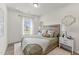 Bedroom with a bed, nightstands, and window views at 509 Marthas View Way, Wake Forest, NC 27587