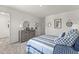 A bright bedroom featuring a stylish dresser and a cozy, inviting bed at 509 Marthas View Way, Wake Forest, NC 27587