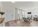 Home office with a door, light walls, wood floors, and a large window for natural light at 509 Marthas View Way, Wake Forest, NC 27587