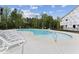Community swimming pool with lounge chairs at 509 Marthas View Way, Wake Forest, NC 27587