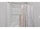 This bathroom features a white shower with a patterned shower curtain and essential fixtures at 510 Mariah Towns Way, Garner, NC 27529