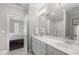 Bright bathroom with double sinks, a large mirror, and a glass-enclosed shower at 510 Mariah Towns Way, Garner, NC 27529