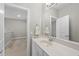 Bright bathroom features a sleek vanity with a white marble countertop and a modern sink at 510 Mariah Towns Way, Garner, NC 27529