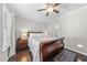 Comfortable bedroom with a queen-sized bed, wood floors, ceiling fan, and a relaxing ambiance at 510 Mariah Towns Way, Garner, NC 27529