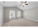 Spacious bedroom featuring vaulted ceiling and two large windows at 510 Mariah Towns Way, Garner, NC 27529