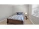 Comfortable bedroom with a large window offering natural light at 510 Mariah Towns Way, Garner, NC 27529