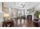 Stylish living room featuring hardwood floors, a cozy fireplace, and comfortable seating arrangements at 510 Mariah Towns Way, Garner, NC 27529