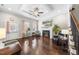 Elegant living room featuring hardwood floors, a cozy fireplace, and stylish decor at 510 Mariah Towns Way, Garner, NC 27529