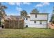 Exterior of house showing deck, lawn, fenced yard and HVAC unit at 5613 Ashton Dr, Raleigh, NC 27612