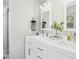 Bright bathroom featuring double sink vanity with white cabinetry and updated fixtures at 5613 Ashton Dr, Raleigh, NC 27612