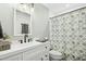 Full bathroom featuring a vanity with a white countertop and a tub-shower with a decorative curtain at 5613 Ashton Dr, Raleigh, NC 27612