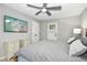 Primary bedroom featuring a ceiling fan, TV, closet, and access to a private back entrance at 5613 Ashton Dr, Raleigh, NC 27612