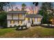 Charming two-story home with landscaped yard and front door wreath at 5613 Ashton Dr, Raleigh, NC 27612