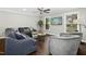 Inviting living room with a large sectional sofa and ceiling fan at 5613 Ashton Dr, Raleigh, NC 27612