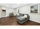 Basement living room with wood-look floors, and a comfortable seating area at 5613 Ashton Dr, Raleigh, NC 27612