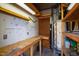 Basement workshop with shelving and work bench at 5819 Windham Dr, Raleigh, NC 27609