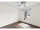 Bright bedroom with hardwood floors, neutral paint, a modern ceiling fan and natural light at 5819 Windham Dr, Raleigh, NC 27609