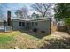 Backyard view of home with siding and brick accents at 5819 Windham Dr, Raleigh, NC 27609