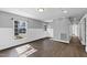 Spacious living room with hardwood floors, recessed lighting, and neutral color scheme at 5819 Windham Dr, Raleigh, NC 27609