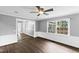 Bright living room features hardwood floors, and a window providing natural light at 5819 Windham Dr, Raleigh, NC 27609