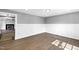 Bright living room with hardwood floors, white wainscoting, and ample natural light at 5819 Windham Dr, Raleigh, NC 27609