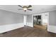 This open-concept living room flows into the kitchen, complete with modern features and hardwood flooring at 5819 Windham Dr, Raleigh, NC 27609