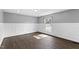 Inviting living room with white wainscoting, hardwood floors, and a large window for natural light at 5819 Windham Dr, Raleigh, NC 27609