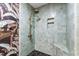 Elegant shower boasting pastel tile, bronze hardware, and convenient built-in niche at 5819 Windham Dr, Raleigh, NC 27609
