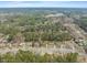 Overhead view of houses in a community with mature trees located along the street at 5913 North Hills Dr, Raleigh, NC 27609