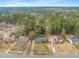 Aerial view of the neighborhood shows house, mature trees, and surrounding homes at 5913 North Hills Dr, Raleigh, NC 27609