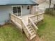Large wooden deck with stairs and railing at 5913 North Hills Dr, Raleigh, NC 27609