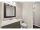 Updated half bathroom with stylish mirror and vanity at 5913 North Hills Dr, Raleigh, NC 27609