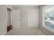 Bright bedroom with closet and natural light at 5913 North Hills Dr, Raleigh, NC 27609
