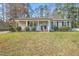 Charming single-story home with a well-maintained front yard and inviting front porch at 5913 North Hills Dr, Raleigh, NC 27609