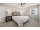 Bedroom featuring a neutral color scheme, ceiling fan and two windows at 5913 North Hills Dr, Raleigh, NC 27609