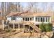 Spacious back porch with stairs down to the backyard at 6021 Dickson Mill Rd, Durham, NC 27705