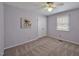 Bedroom with carpet, a window with blinds, a ceiling fan and closet at 6021 Dickson Mill Rd, Durham, NC 27705