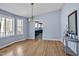 Open dining space with contemporary lighting, a decorative table, and a glimpse of the kitchen at 6021 Dickson Mill Rd, Durham, NC 27705
