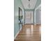 Inviting entryway with hardwood floors, a stylish table, and a decorative mirror at 6021 Dickson Mill Rd, Durham, NC 27705