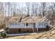 Charming one-story home with light blue siding, brick accents, and a welcoming front porch at 6021 Dickson Mill Rd, Durham, NC 27705