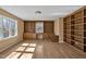 Bright office with hardwood floors, built-in shelving, lots of storage, and natural light at 6021 Dickson Mill Rd, Durham, NC 27705