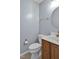 Cozy powder room featuring a new round mirror and wood vanity at 6021 Dickson Mill Rd, Durham, NC 27705