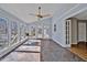 Bright sunroom featuring multiple windows, and tile floors at 6021 Dickson Mill Rd, Durham, NC 27705